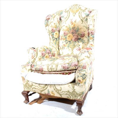 Lot 431 - A wing-back easy chair