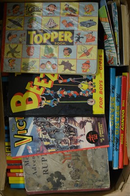 Lot 464 - British comic annuals; a large collection in four boxes, including The Dandy, The Beano, The Topper, The Beezer, Rupert the Bear and others, 1940s to 1990s examples.