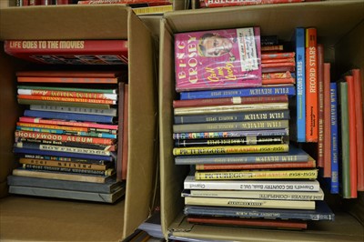 Lot 66 - Film, music and cinema books; a large collection, including annuals, five boxes.