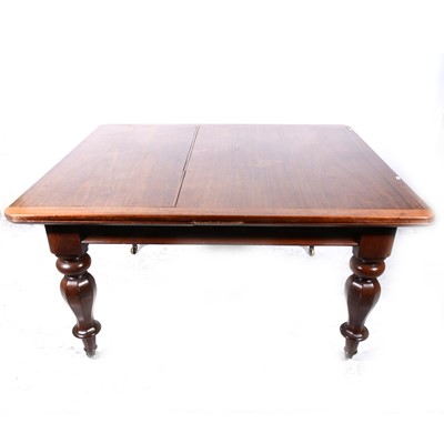 Lot 381 - A mahogany draw-leaf dining table