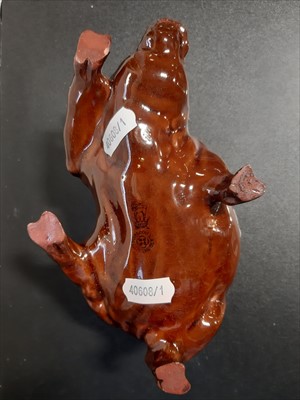 Lot 10 - A Royal Doulton treacle glazed pig dish modelled by Charles Noke.