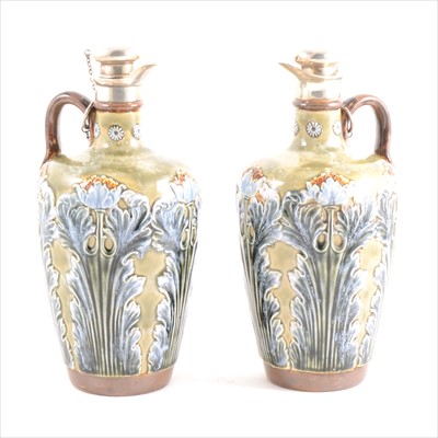 Lot 1 - A pair of Doulton stoneware flasks with silver rim and stoppers with corks.