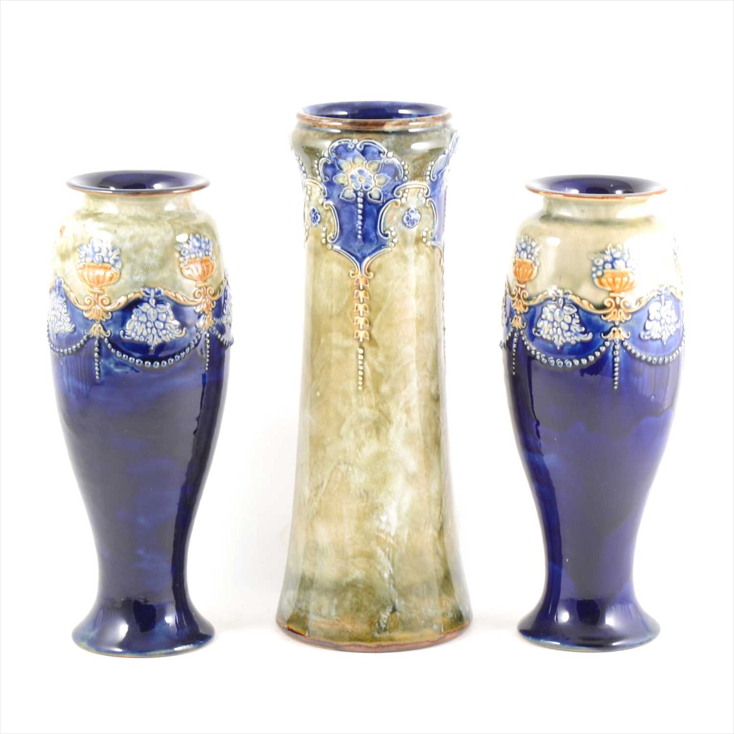 Lot 40 - A pair of Doulton stoneware vases and similar single cylindrical vase.