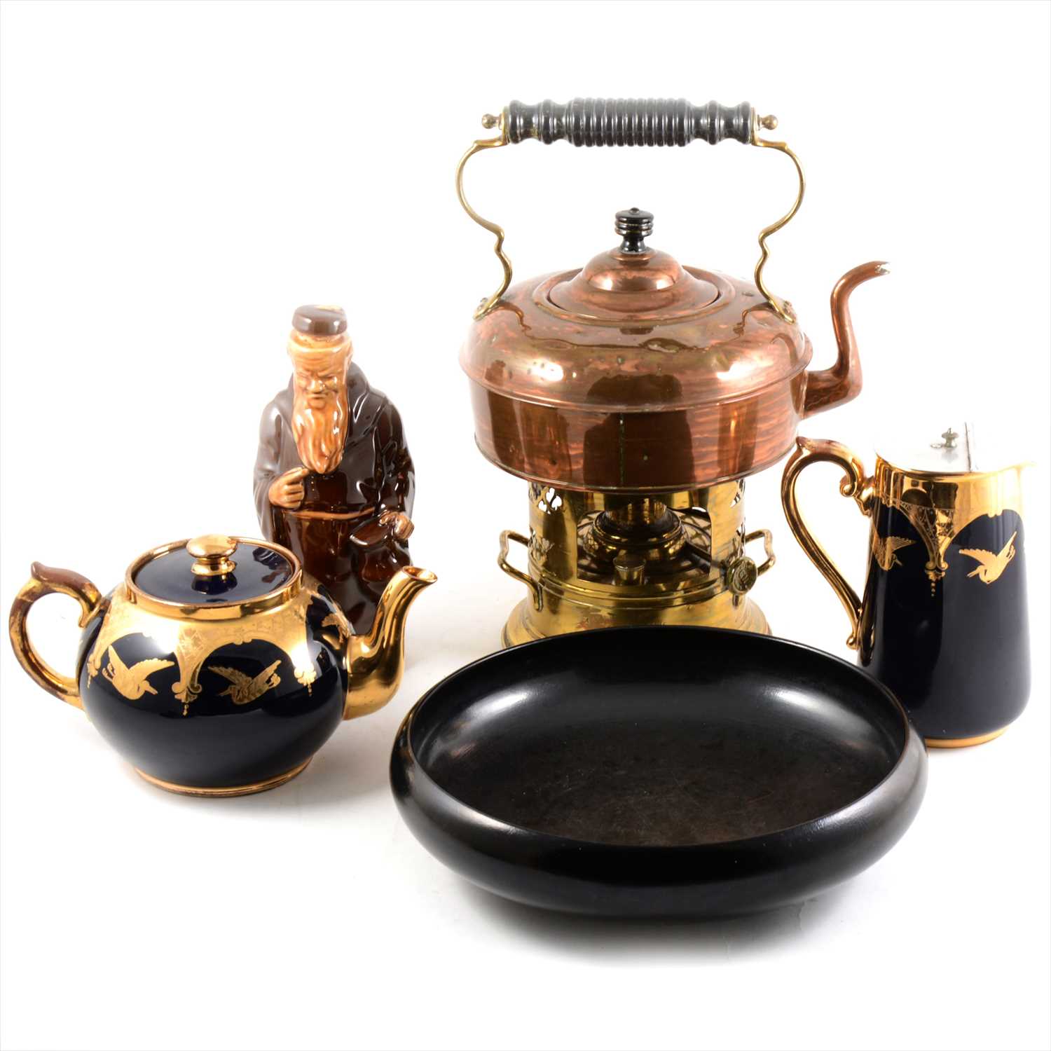 Lot 15 - A copper kettle with brass burner, Doulton black dish, teapot, milk jug and monk decanter.