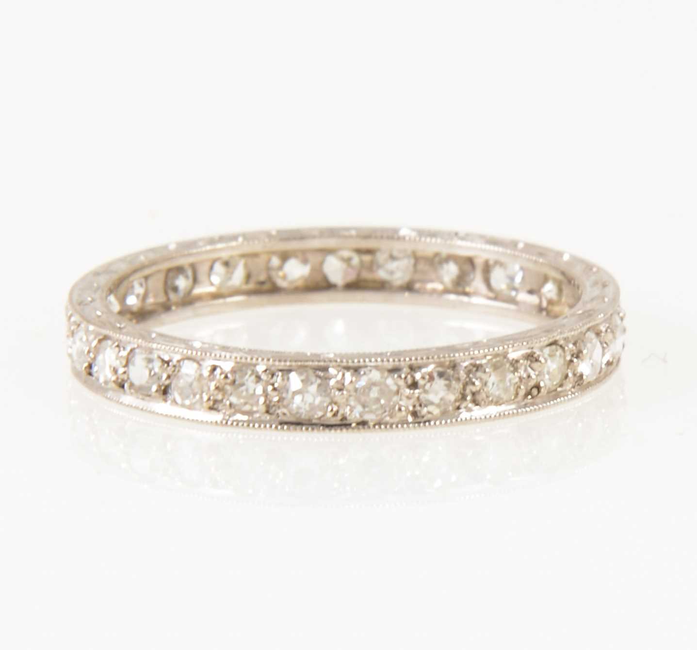 Lot 15 - A diamond full eternity ring.