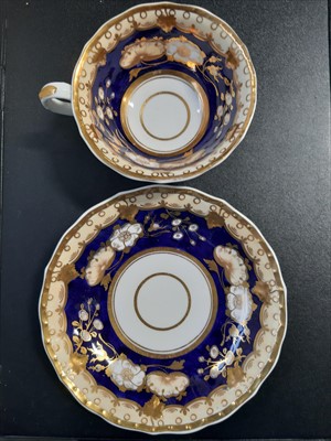 Lot 13 - A Crown Derby cup and saucer "In North Wales." and four others