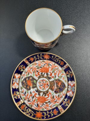 Lot 13 - A Crown Derby cup and saucer "In North Wales." and four others