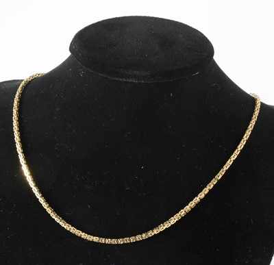 Lot 112 - An 18 carat yellow gold square kings pattern chain necklace.