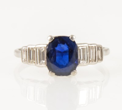 Lot 18 - A sapphire and diamond ring.