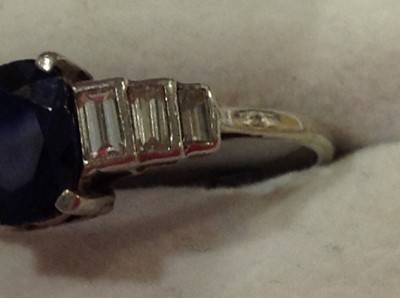 Lot 18 - A sapphire and diamond ring.