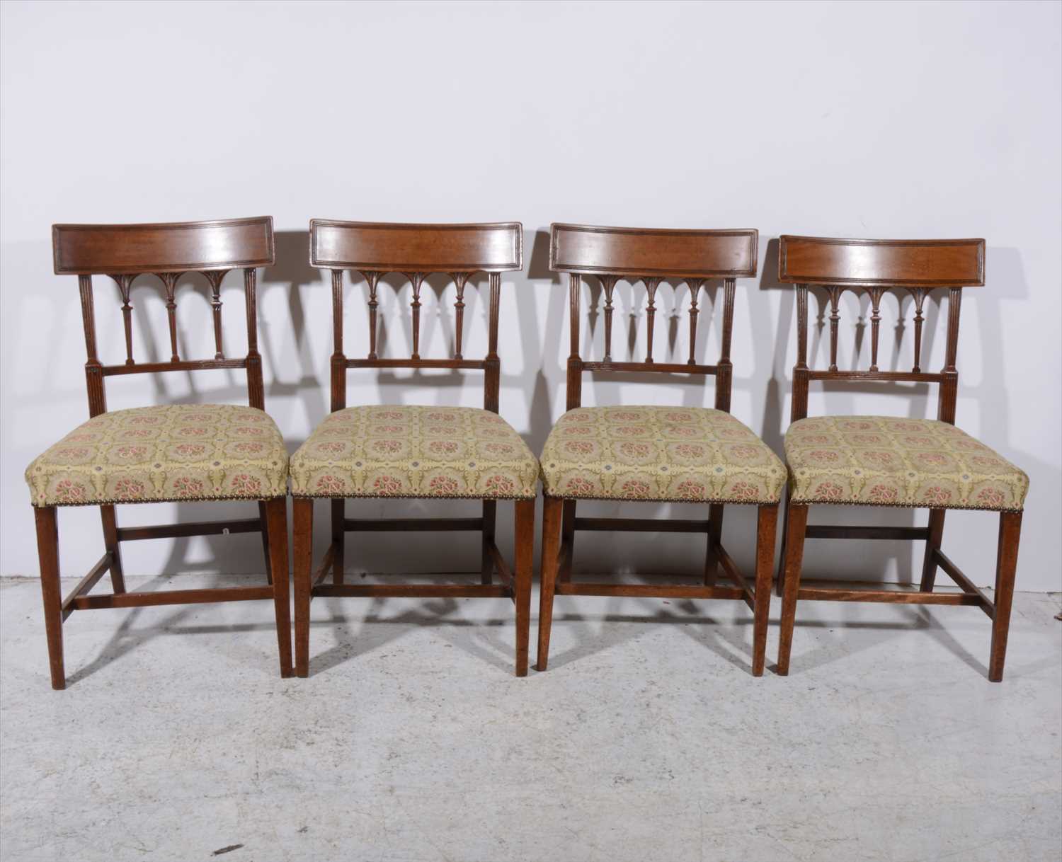 Lot 298 - A set of seven Sheraton style mahogany dining chairs