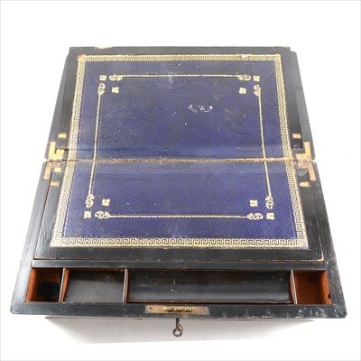 Lot 115 - A Victorian walnut writing box, brass outlines