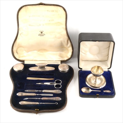 Lot 174 - A part silver manicure set, London 1916-18, incomplete, and a silver egg cup and spoon
