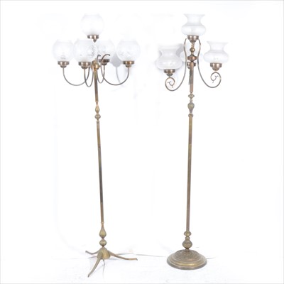 Lot 473 - Two candelabra style floor lamps, with glass shades and a selection of spare shades.