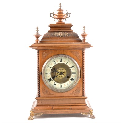 Lot 231 - A German stained beechwood mantel clock