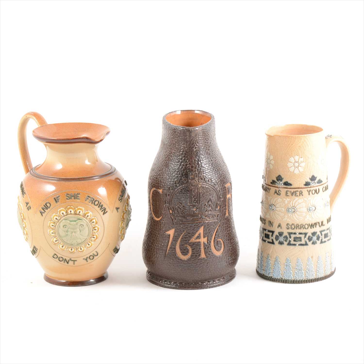 Lot 6 - Three Doulton Lambeth stoneware jugs, including a Slater's Jack jug for King Charles' coronation 1646