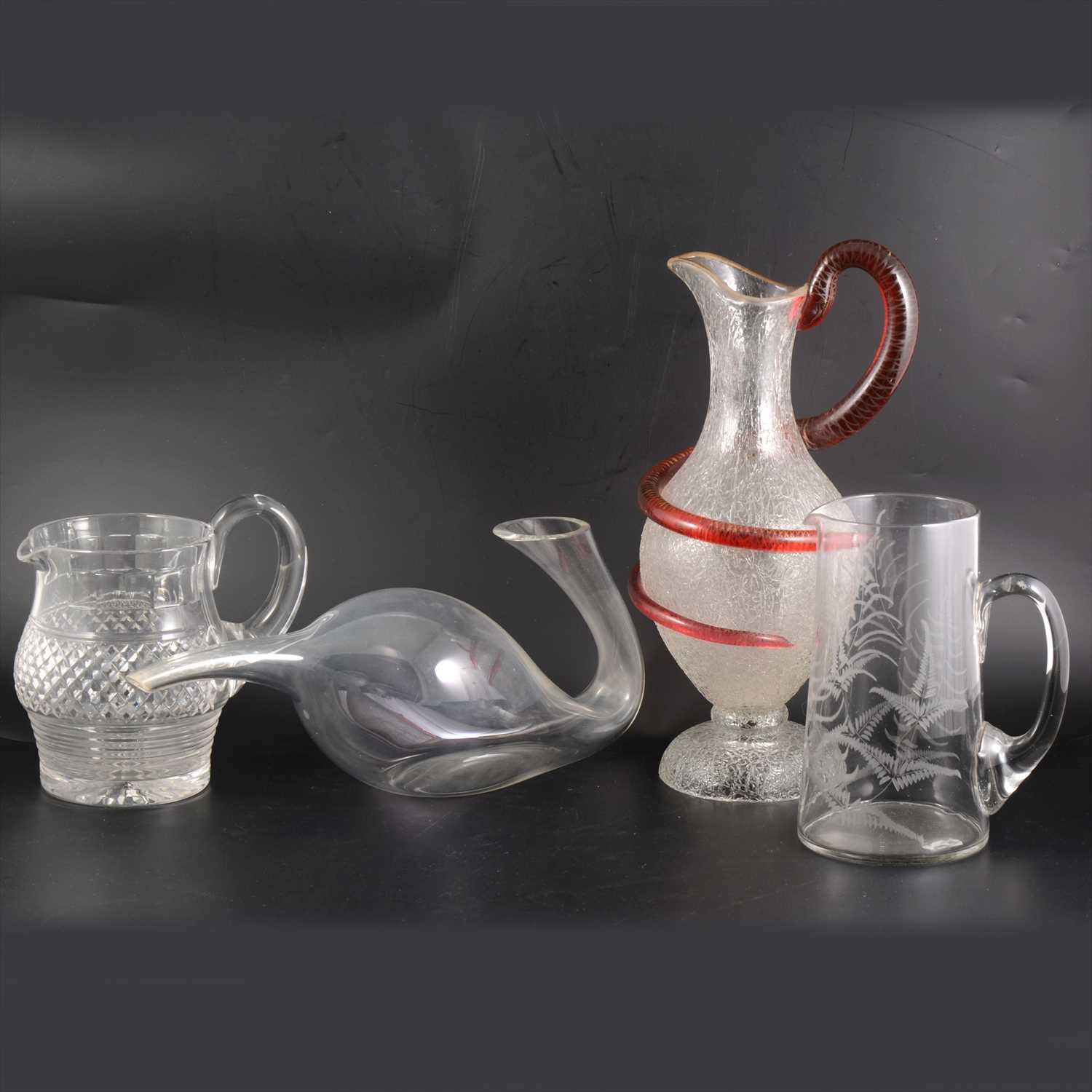 Lot 75 - Frosted glass ewer with coiled serpent handle, collection of glass jugs, decanters etc.