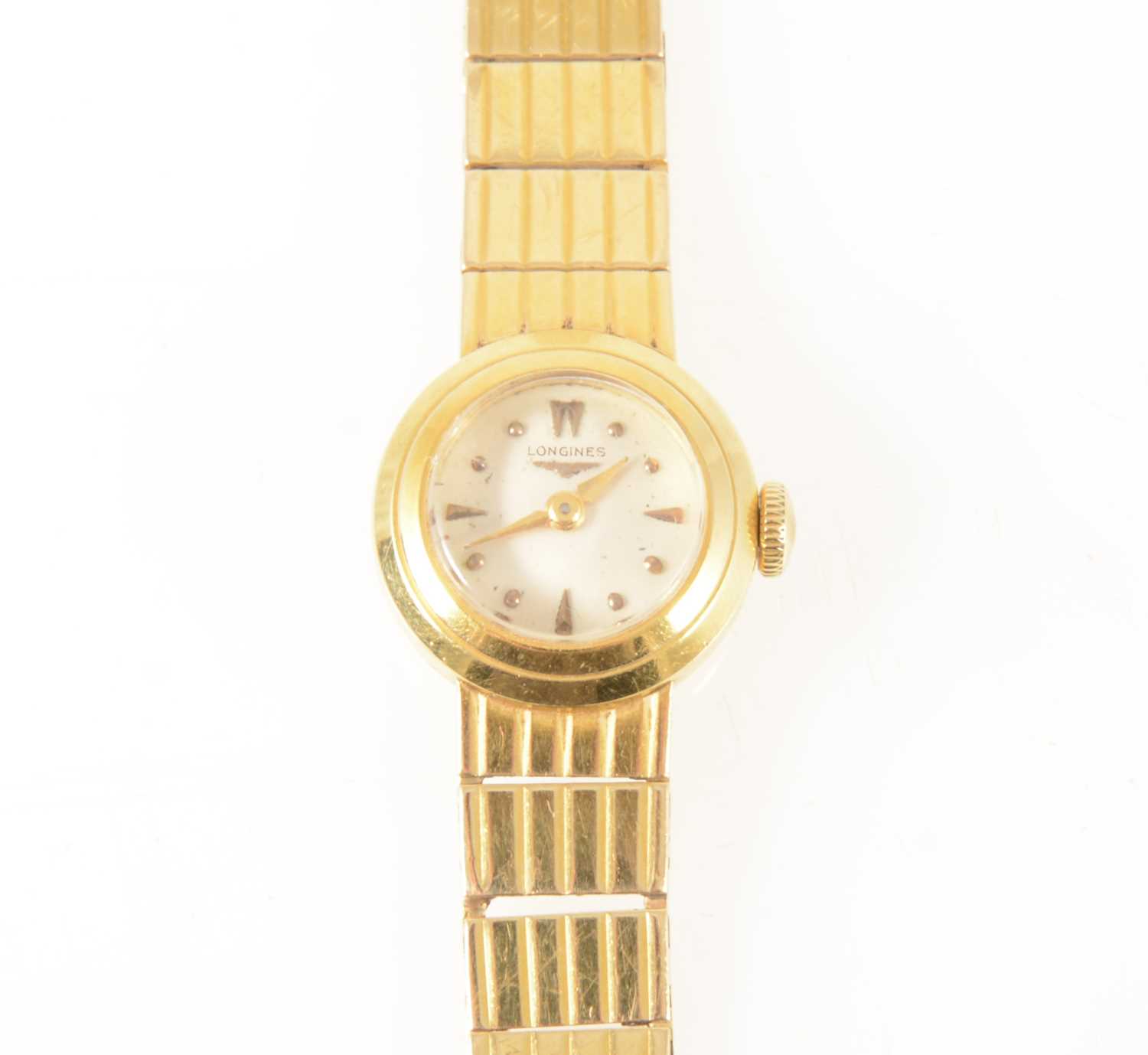 Lot 155 - Longines - a lady's yellow metal bracelet watch.