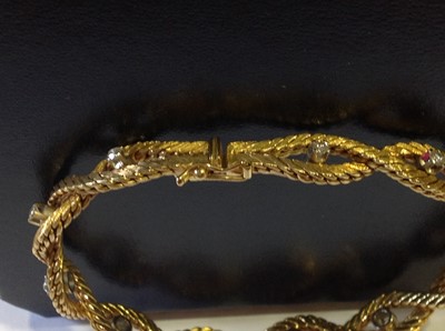 Lot 84 - An 18 carat yellow gold bracelet set with eleven diamonds.