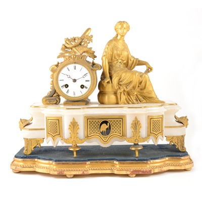 Lot 394 - A Louis XVI style gilt metal and onyx mantel clock, 19th century