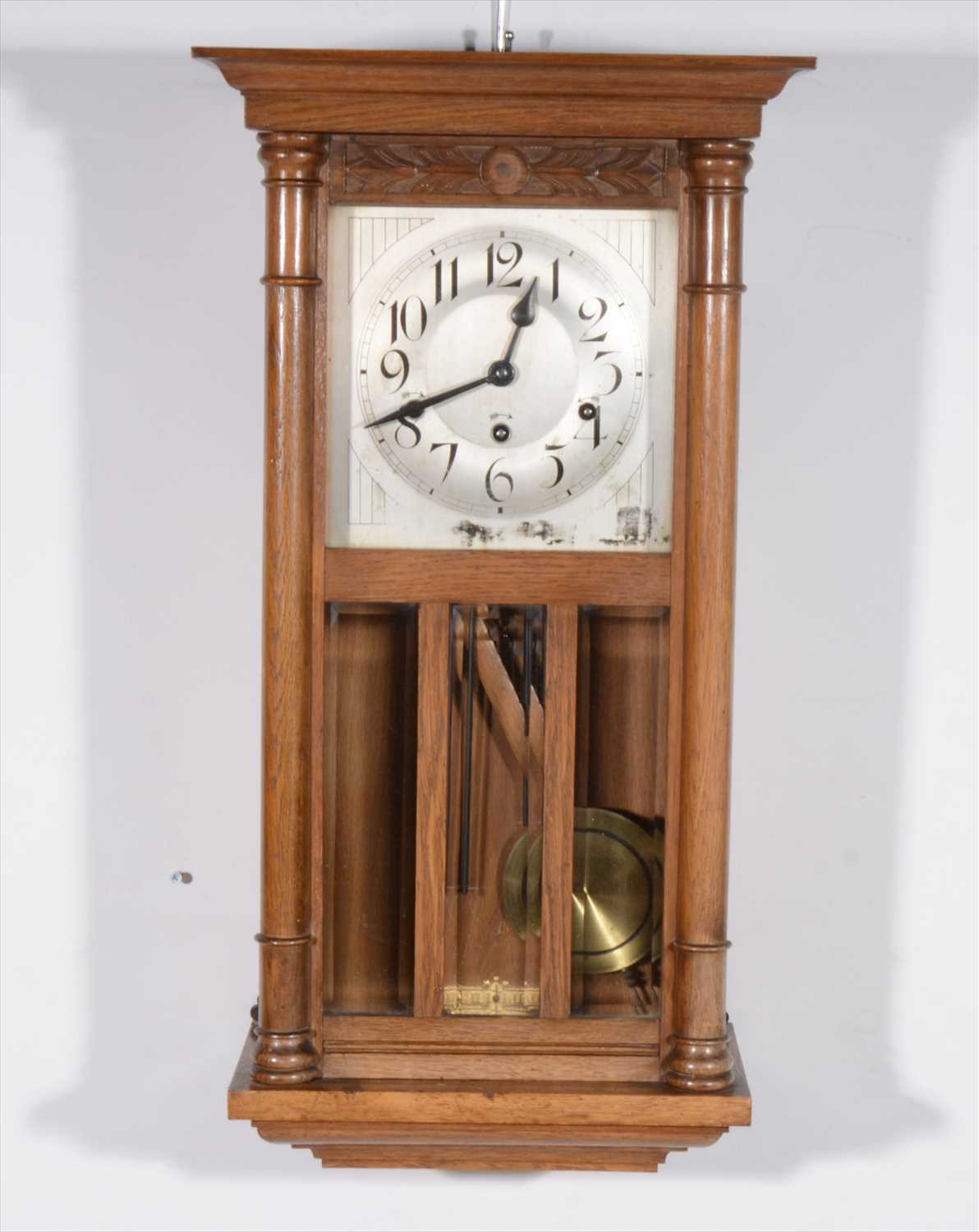 Lot 477 - A light oak wall clock