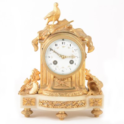 Lot 393 - A Louis XVI style gilt metal and alabaster mantel clock, 19th century