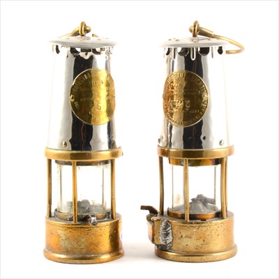 Lot 89 - Two brass and steel miner's safety lamps, labelled The Protector Lamp & Lighting Co. Limited