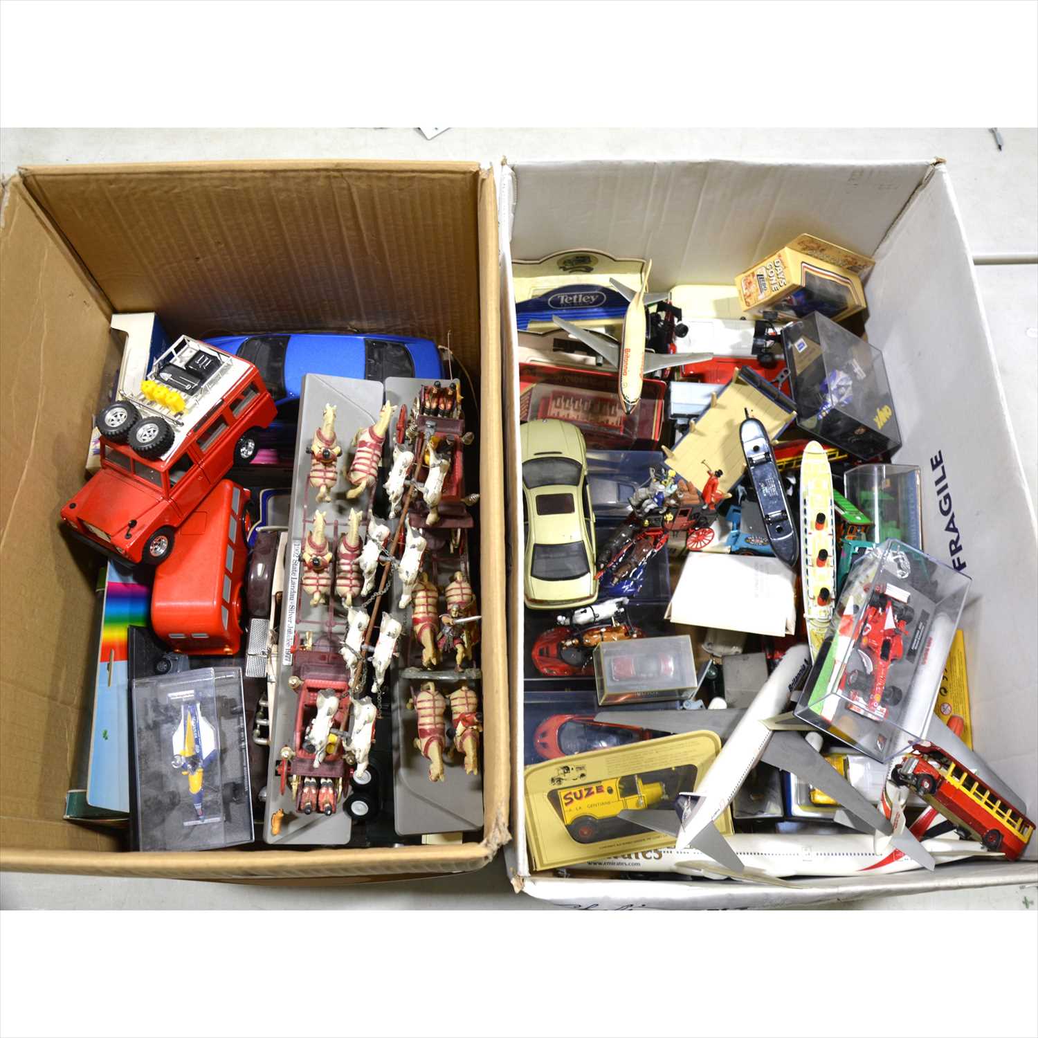 Lot 216 - Two boxes of modern die-cast models; including Burago, Onyx, Dinky Atlas, Lledo, and others, some boxes and some loose.