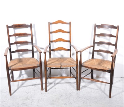 Lot 300 - A pair of Arts & Crafts style oak elbow chairs, and another.