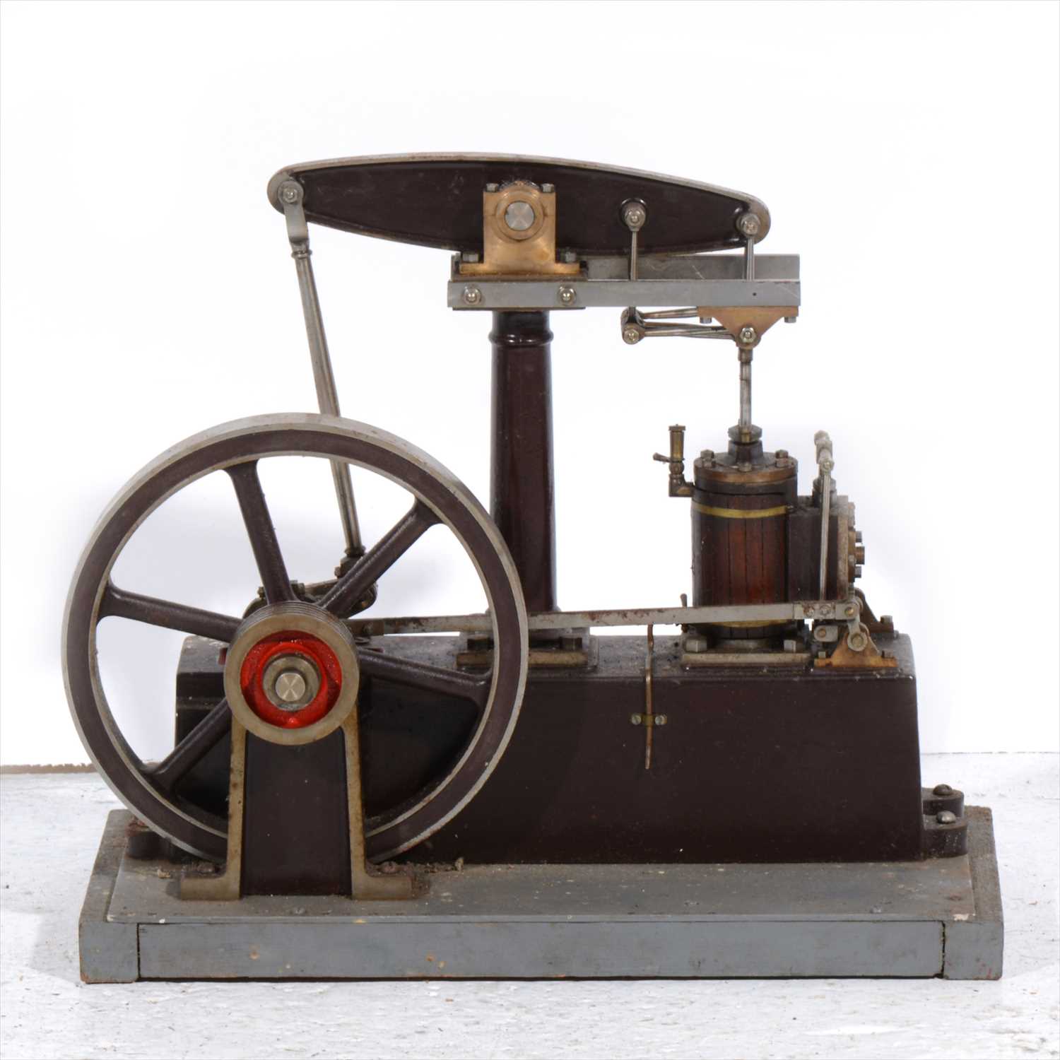 Lot 4 - A Stuart Turner beam engine; live steam model with 7inch flywheel, mounted into wooden base, 32cm length.