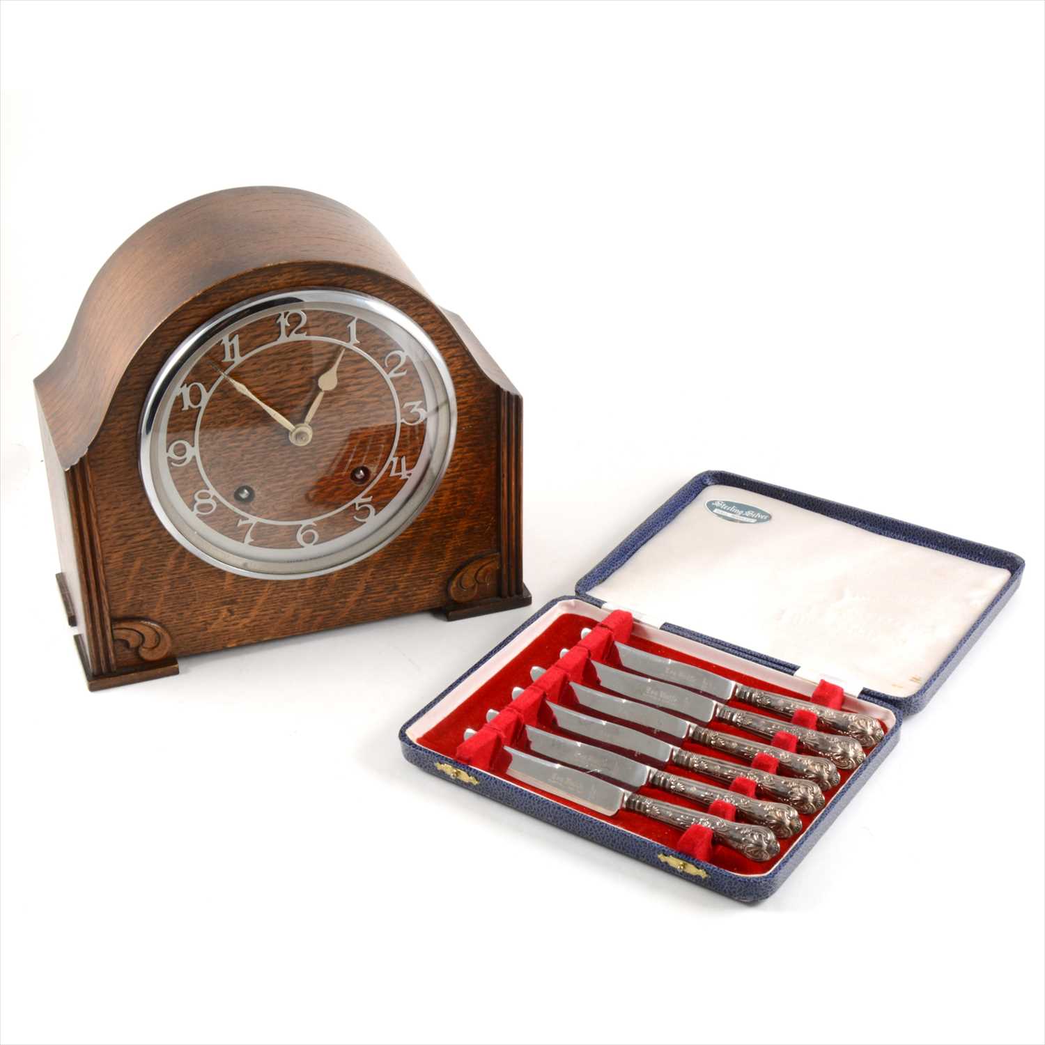 Lot 67 - An oak cased twin train mantel clock and cased set of tea knives.