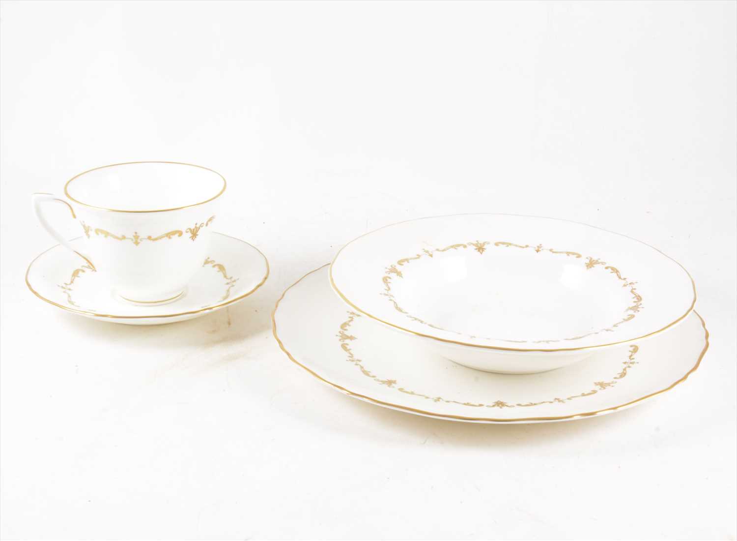 Lot 60 - A Royal Worcester bone china table service, 'Gold Chantilly' pattern