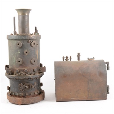 Lot 12 - A cast metal vertical upright live steam boiler and another horizontal boiler part.