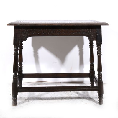 Lot 385 - A carved oak occasional table