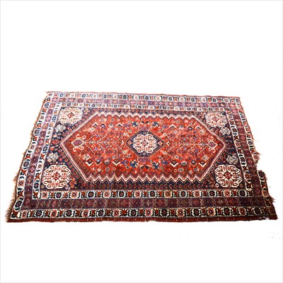 Lot 501 - A Persian carpet, probably Qashqa'i, with madder red ground