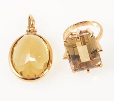 Lot 1279 - A smoky quartz dress ring and citrine pendant.