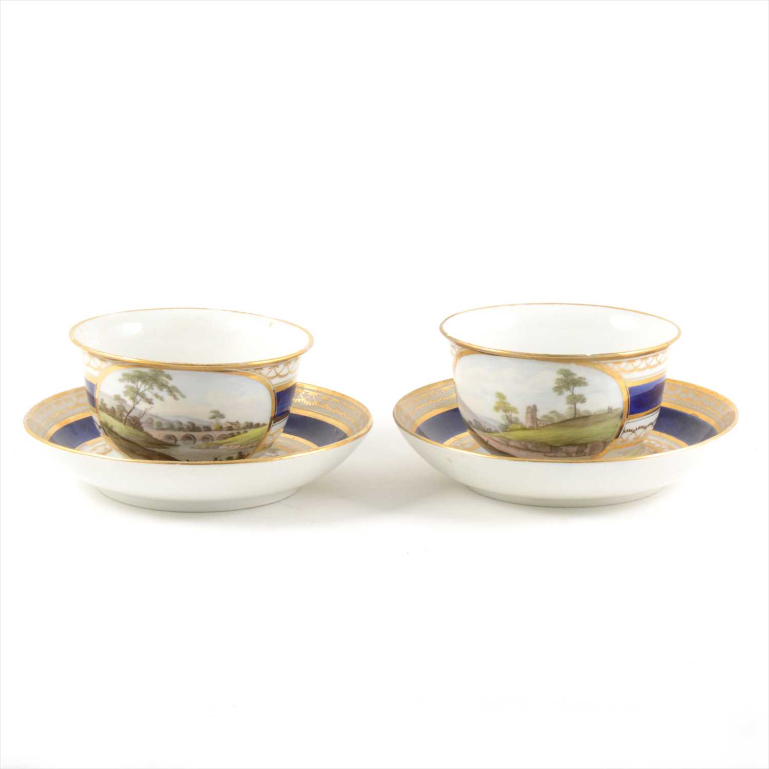 Lot 8 - A pair of Derby style porcelain breakfast cups and saucers, with named views, Nr Caernarfon, South Wales
