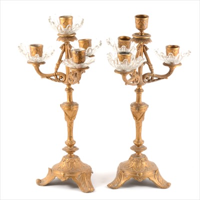 Lot 221 - A pair of four-light gilt metal candelabra