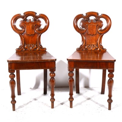 Lot 334 - A pair of early Victorian mahogany hall chairs