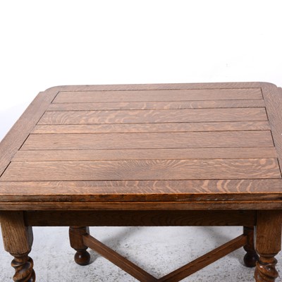 Lot 111 - An oak draw-leaf dining table, and four dining chairs