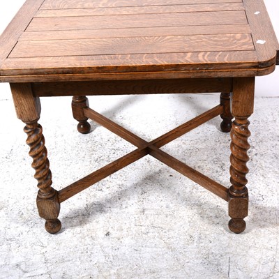 Lot 111 - An oak draw-leaf dining table, and four dining chairs