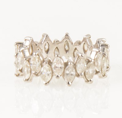 Lot 1248 - A marquise cut diamond full eternity ring.