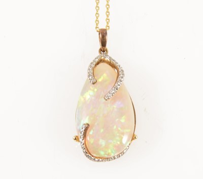 Lot 123 - An opal and diamond pendant and chain