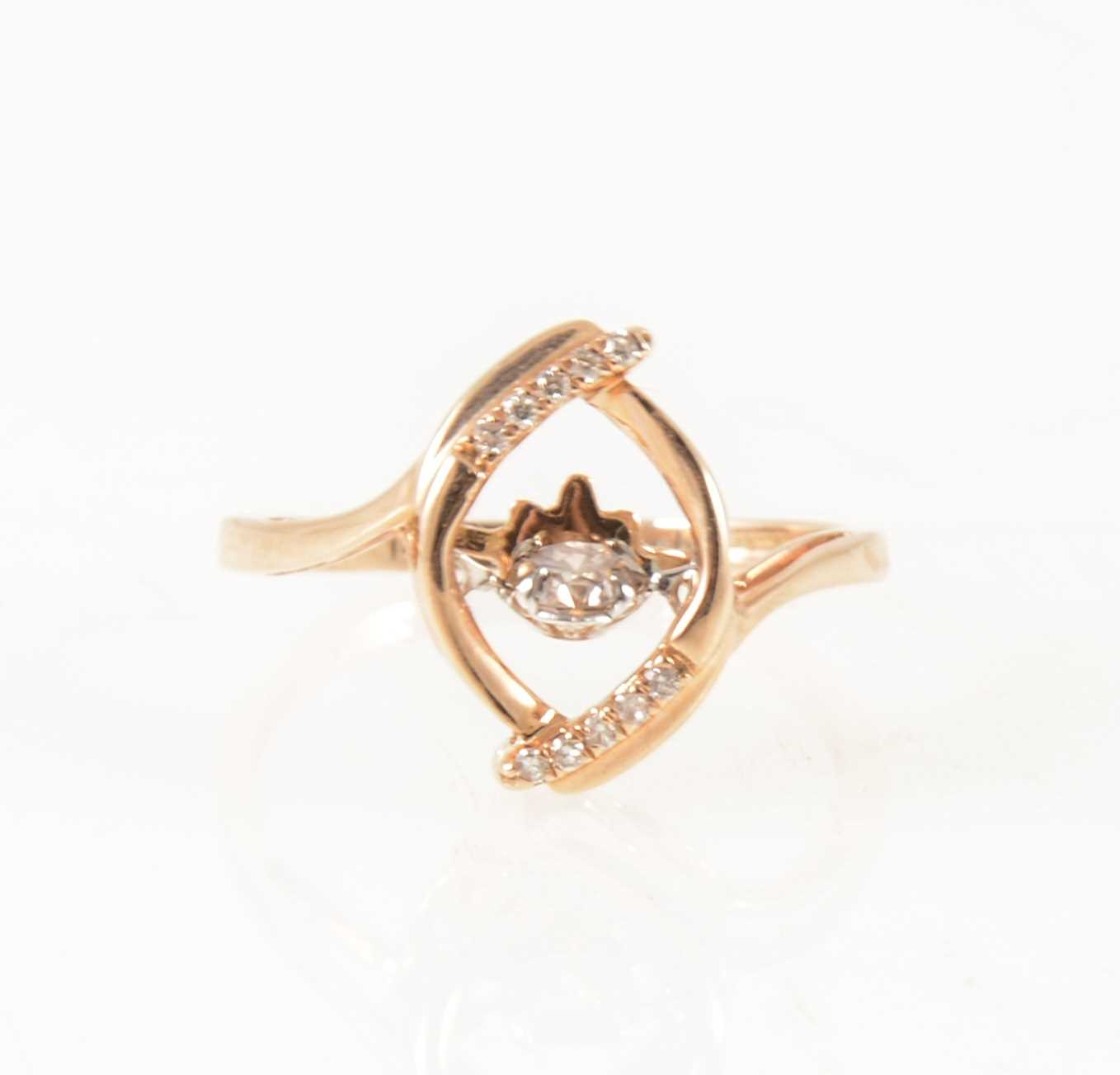 Lot 1259 - A dancing diamond dress ring.