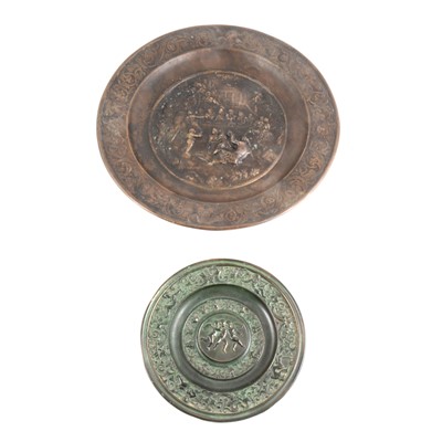 Lot 1100 - Two cast metal chargers, after the Antique