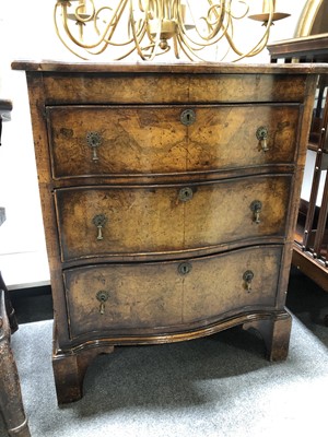 Lot 537 - A George II style walnut serpentine front chest of drawers