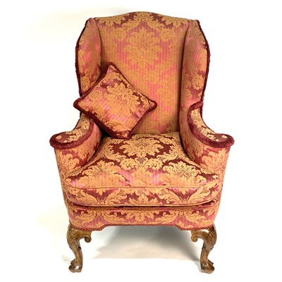 Lot 294 - A Georgian style wing-back easy chair