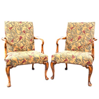 Lot 300 - A pair of Georgian style walnut elbow chairs