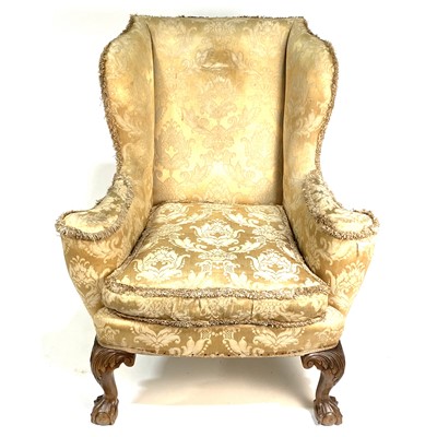 Lot 587 - A Georgian style wing-back easychair