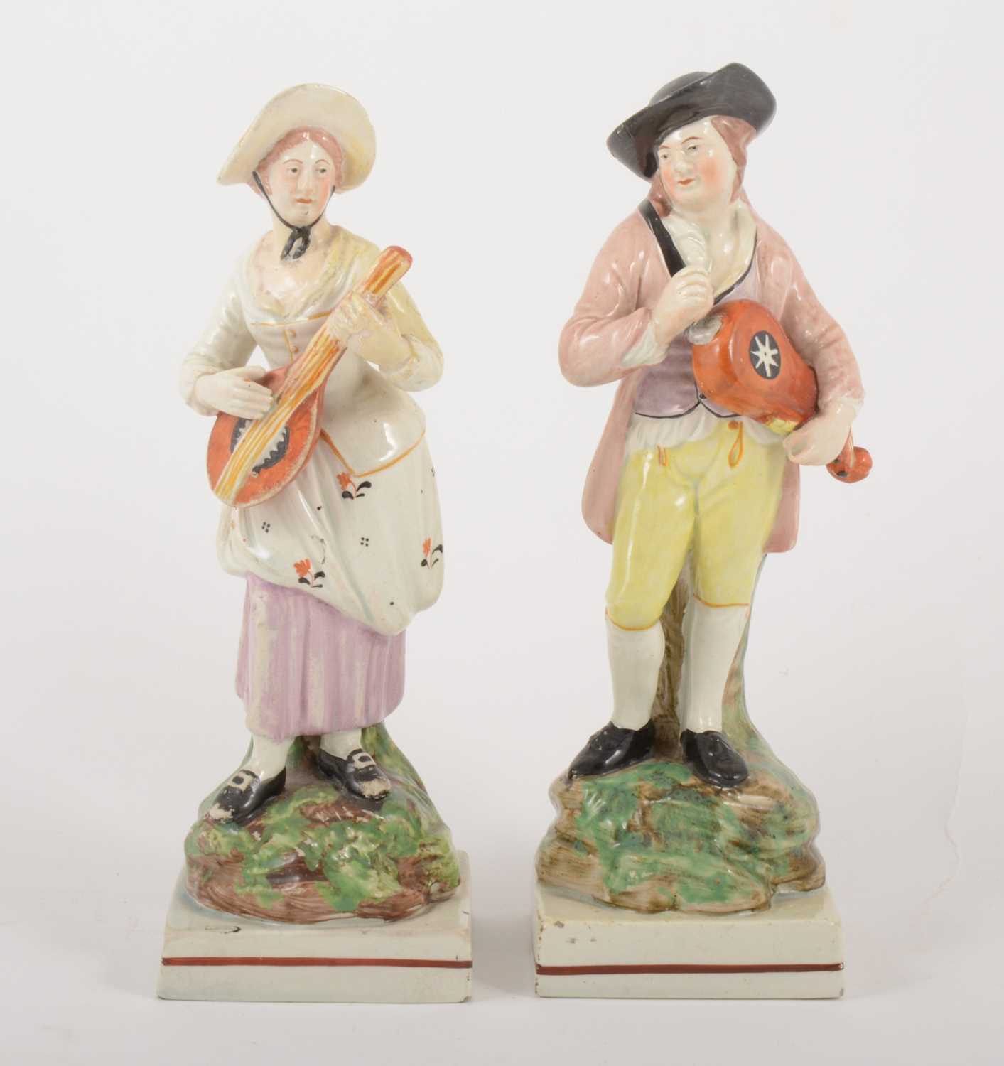 Lot 2 - A pair of Staffordshire pearl glazed earthenware figurines